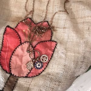 16 inch necklace with three pendants. Sterling silver with rose gold color.